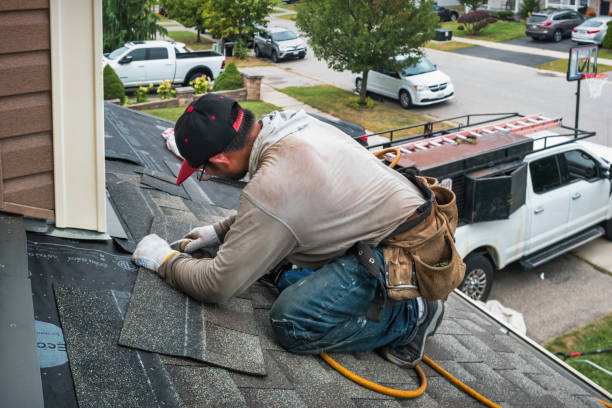 Professional Storm Damage Roof Repair technician working in Island Park, NY
